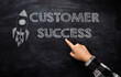 © Алла Морозова - Person points to phrase Customer Success on blackboard