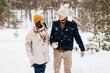 © Syda Productions - people, love and leisure concept - happy smiling couple walking in winter forest