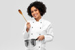 © Syda Productions - culinary and people concept - happy smiling female chef in jacket with saucepan cooking food over grey background