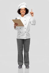 Sticker - cooking, culinary and people concept - happy smiling female chef in toque and jacket with clipboard showing thumbs up over grey background