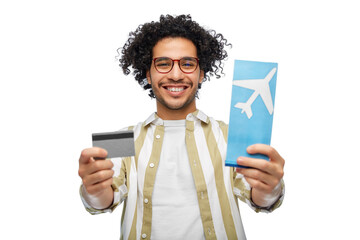 Wall Mural - travel, tourism and people concept - smiling man with air ticket and credit card over white background