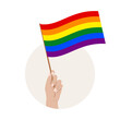 Tęczowa flaga w uniesionej dłoni. Symbol społeczności LGBTQ. Tolerancja, wolność, miłość, różnorodność. Ilustracja wektorowa na LGBT Pride Month.