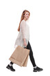 © ASDF - Side view of going beautiful girl with shopping bags.
