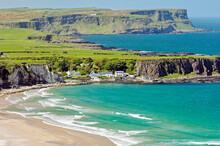 White Park Bay On The Giants Causeway Coast Of County Antrim, Ireland. Looking To Portbraddon Village And The Causeway Headlands