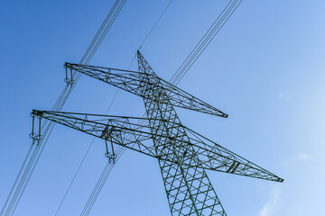 High voltage pole with electric wires.