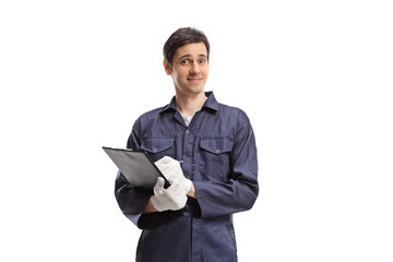 Wall Mural - Young male worker in a uniform holding a clipboard