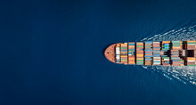 Aerial Top Down View Of A Large Container Cargo Ship In Motion Over Open Ocean With Copy Space