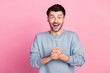 Photo of satisfied impressed man hold arms beaming smile cant believe isolated on pink color background