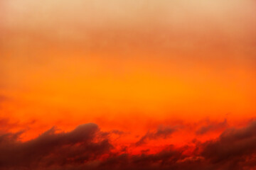 Wall Mural - red storm clouds with a light