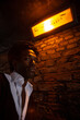 © track5 - Out of the Shadows. A character emerging from the shadows of a dark and narrow London alleyway. From a series of images with the same models.