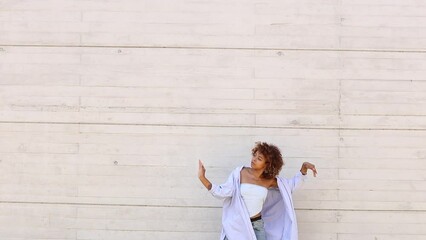 Wall Mural - girl dancing in the street half body with copy-space