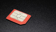 Red Sim Card For 4G,  Gsm Mobile Phone On Black Background