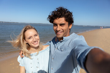 Wall Mural - couple of lovers on a romantic date at the beach