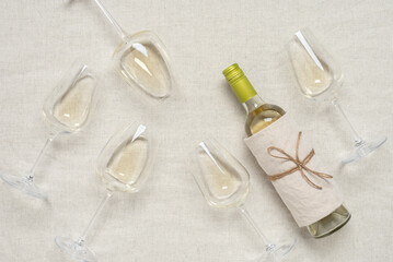 Wall Mural - Flat lay white wine. Wine tasting concept. View from above. Beige linen background.