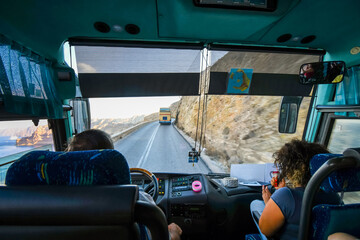 view from a tour bus traveling on the winding hillside road from thera to the cruise port on the isl