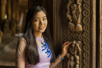 Wall Mural - Myanmar woman in Burmese traditional dress at Shwenandaw Kyang monastery in Mandalay Myanmar