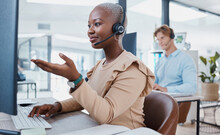 Call Center, Customer Service And Support With An Agent Working To Help On A Call Online In Her Office. Contact Us, Telemarketing And Consulting With A Consultant In A Headset Giving Helpful Advice