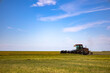 Agricultural machinery in operation in the fields. A new trend in technology.