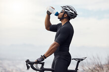 Sports Man With A Bike Drinking Water Bottle Doing Fitness Training Or Workout On Sky Mockup Background. Healthy, Professional Athlete Cyclist With A Bicycle During Cycling Cardio Exercise In Nature