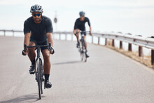 Bike, Fitness And Exercise With A Man Cyclist Training On A Bicycle For Sport, Health Or Exercise Outside. Sports, Wellness Or Fitness With A Healthy Athlete Doing A Workout For Cardio And Endurance