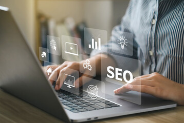 Wall Mural - seo concept.women using a computer with seo icon for analysis seo search engine optimizing your webs