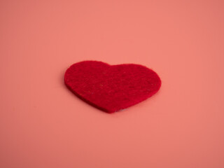 Red heart on a pink background. Love concept.