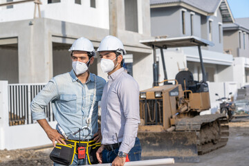 Poster - Engineer discussing with Architect about project in building construction site.