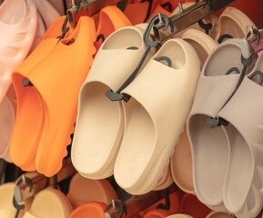 Rubber flip flops on the counter in the market.