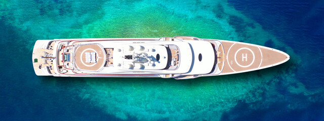Wall Mural - Aerial drone ultra wide panoramic top view photo of large luxury yacht - boat with helicopter landing area anchored in tropical exotic paradise bay with turquoise sea