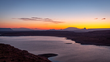 Wall Mural - morning golden sunrise over the rocky desert mountains of lake powell in northern page arizona