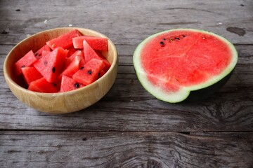 Wall Mural - Watermelon summer fruit on wood background