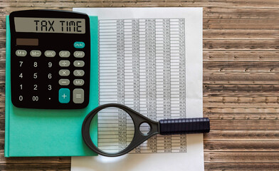 Tax Time word on calculator. Business and tax concept. Time to pay tax in year.