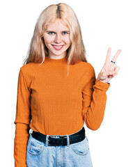 Poster - Young caucasian woman wearing casual clothes smiling looking to the camera showing fingers doing victory sign. number two.