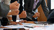 © bongkarn - Businesspeople celebrating at the meeting room. winning, achievement hand gesture.