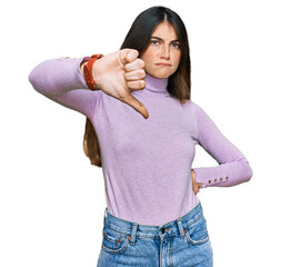 Poster - Young beautiful teen girl wearing turtleneck sweater looking unhappy and angry showing rejection and negative with thumbs down gesture. bad expression.