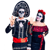 Young Couple Wearing Mexican Day Of The Dead Costume Over Background Showing And Pointing Up With Fingers Number Nine While Smiling Confident And Happy.