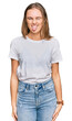 © Krakenimages.com - Beautiful young blonde woman wearing casual white t shirt sticking tongue out happy with funny expression. emotion concept.