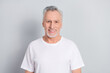 Photo of good old man wear white t-shirt isolated on grey color background