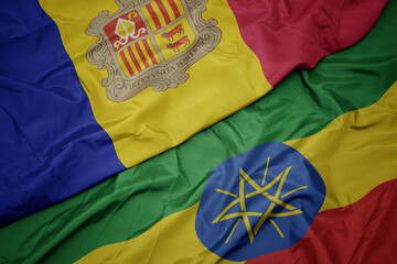 waving colorful flag of ethiopia and national flag of andorra.