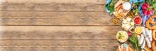 Oktoberfest Holiday Greeting Card, Menu, Invitation Background, Traditional Oktoberfest Festival Food, Bavarian Sausages, Pretzels, Potato, Sauerkraut, Beer Mug On Wooden Background, Banner Format