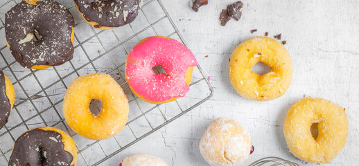 .Donuts on a white wood background