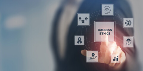 Business ethics concept. Ethical investment, sustianable development. Business integrity and moral. Businessman touching on BUSSINESS ETHICS wording on smart screening surrounded by ethical elements.