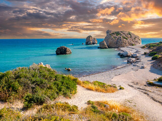 Cyprus sunset. Rocks of Aphrodite. Bay of Petra-Tu-Romiou. Beach next to village of Kuklia. Tour to island of Cyprus. Rocks of Aphrodite during sunset. Mediterranean beach. Summer Cyprus