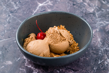 Canvas Print - Tasty appetizing chocolate ice cream with cherry and pistachios