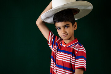 Wall Mural - portrait of an Asian boy wearing cowboy hat