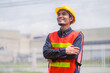 © Suriyo - Asian Engineer construction confident on site building and Survey civil architect by contractor business with safety helmet factory background