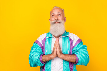 Sticker - Portrait of peaceful granddad hands palms touch pray look empty space isolated on yellow color background