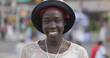 Youn black woman smile happy face portrait on a city street