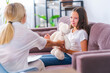 unhappy crying child talks to psychologist about her problems, hugging teddy bear, at home or in office, expressing emotions. sad teenage girl listens to psychologist, looking for way out situation