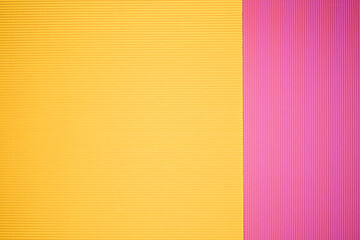 Pink and yellow two tone color paper background with stripes. Abstract background modern hipster futuristic. Texture design